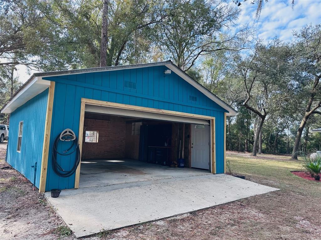 13750 Northwest 88th Terrace Chiefland, FL 32626 - Photo 25 of 33 a view of a house with a garage