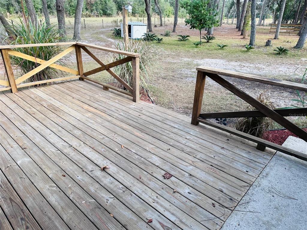 13750 Northwest 88th Terrace Chiefland, FL 32626 - Photo 5 of 33 a view of backyard with wooden deck