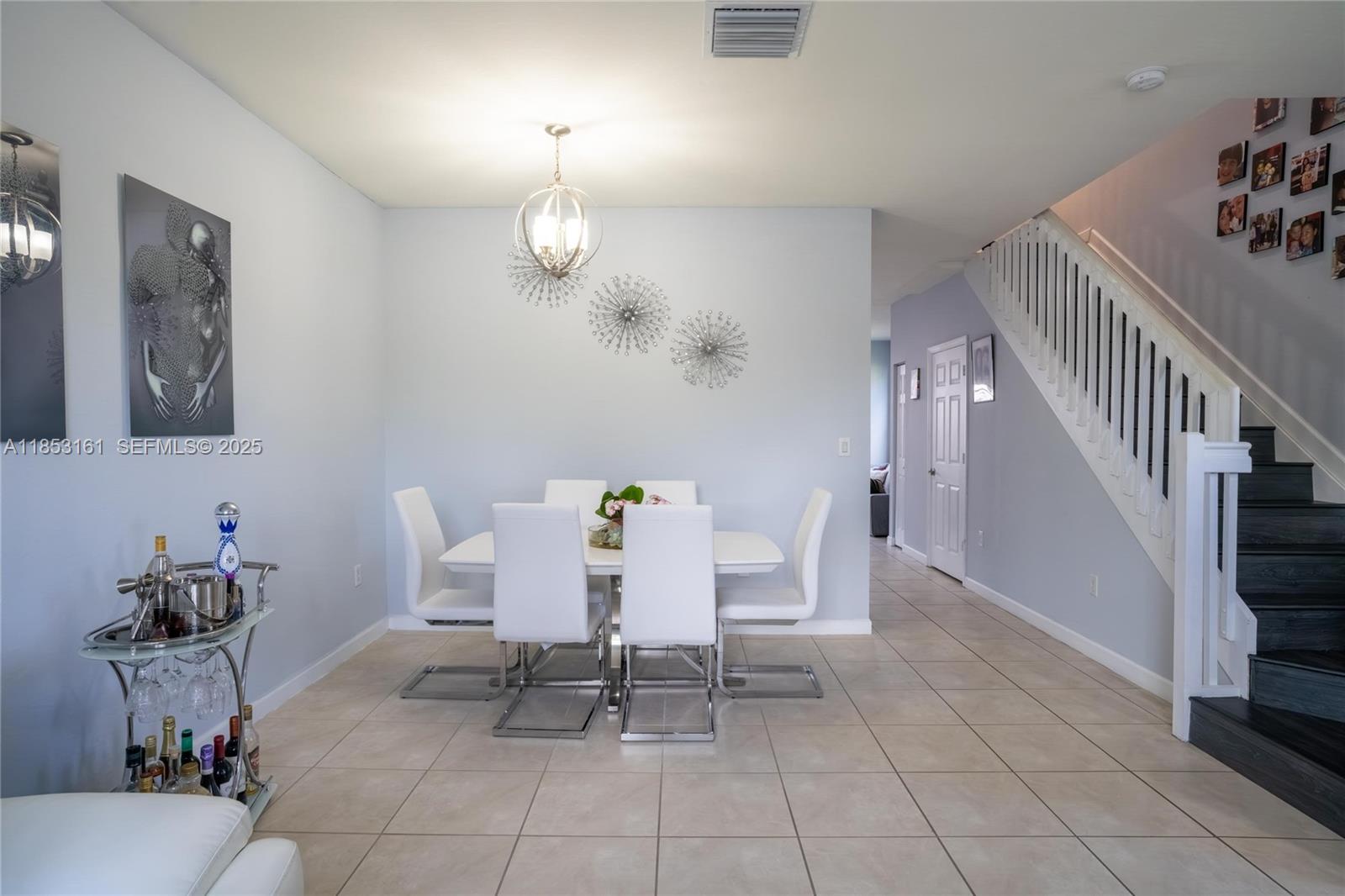 11571 Southwest 248th Lane Homestead, FL 33032 - Photo 12 of 26 a view of a livingroom with furniture and a dinning area with furniture