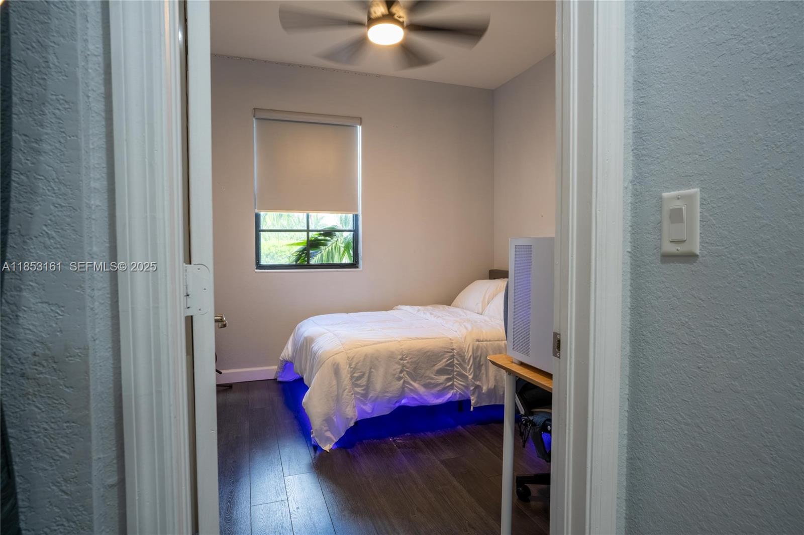 11571 Southwest 248th Lane Homestead, FL 33032 - Photo 22 of 26 a bedroom with a bed and a window