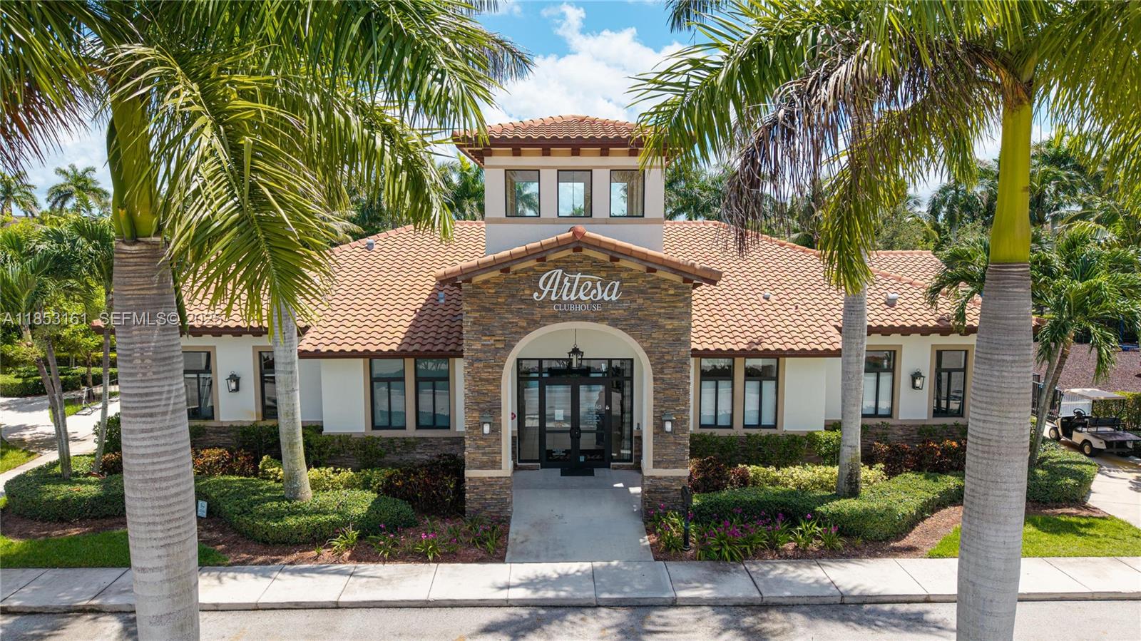 11571 Southwest 248th Lane Homestead, FL 33032 - Photo 6 of 26 a front view of a house with yard and parking