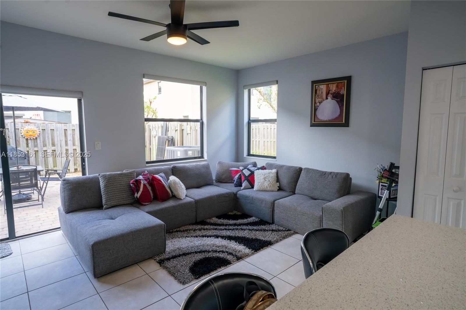 11571 Southwest 248th Lane Homestead, FL 33032 - Photo 9 of 26 a living room with furniture and a window