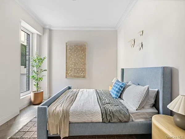 a bedroom with a bed and a couch