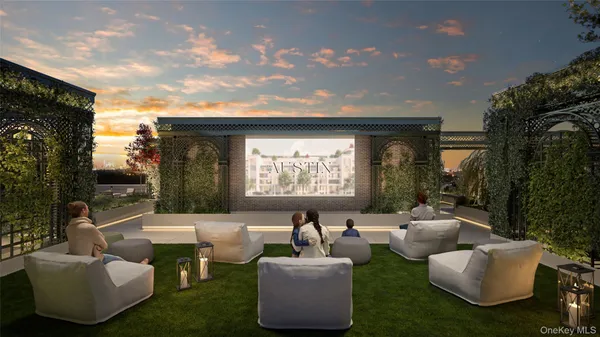 a living room with couches and a flat screen tv