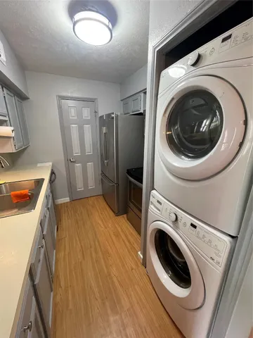 a view of a storage and utility room with washer and dryer