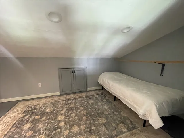 a bedroom with a bed and a cabinets