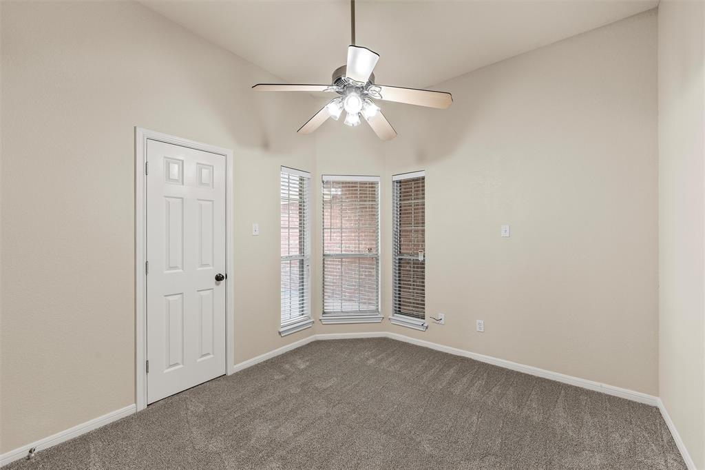 940 Cheyenne Trail Hewitt, TX 76643 - Photo 20 of 40 Empty room with a ceiling fan and dark colored carpet