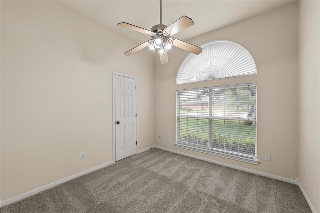 940 Cheyenne Trail Hewitt, TX 76643 - Photo 23 of 40 Unfurnished room featuring a ceiling fan, carpet floors, and vaulted ceiling
