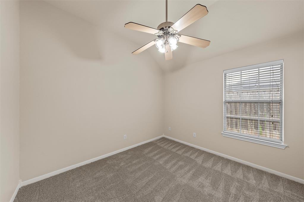 940 Cheyenne Trail Hewitt, TX 76643 - Photo 24 of 40 Carpeted empty room with lofted ceiling and ceiling fan