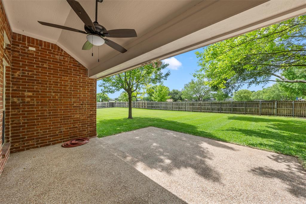 940 Cheyenne Trail Hewitt, TX 76643 - Photo 26 of 40 Fenced backyard with ceiling fan and a patio