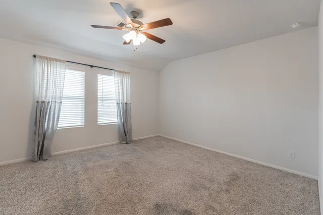 a swimming pool with wooden fence