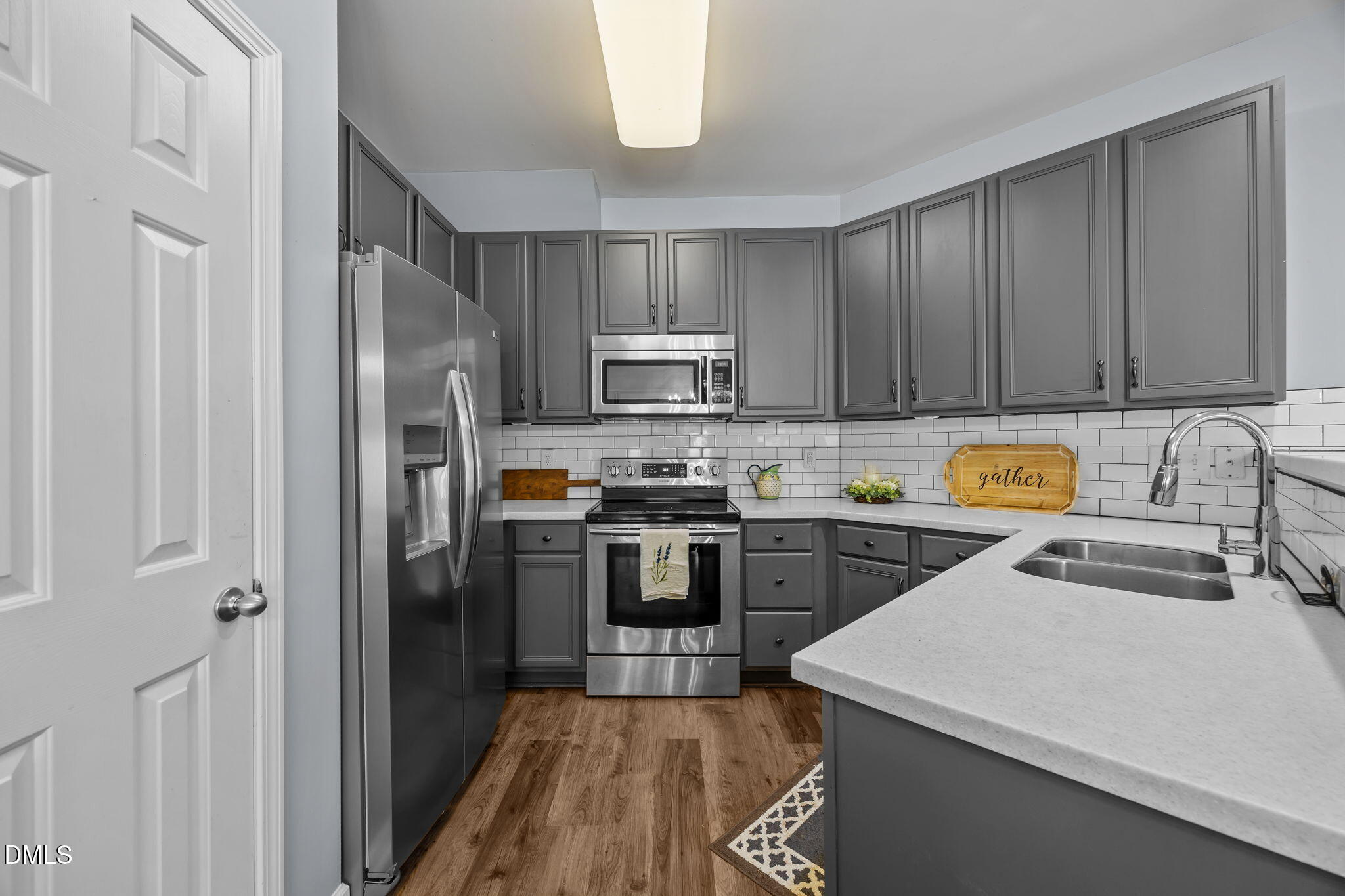 153 Deacon Ridge Street Wake Forest, NC 27587 - Photo 11 of 34 a kitchen with a refrigerator sink and microwave