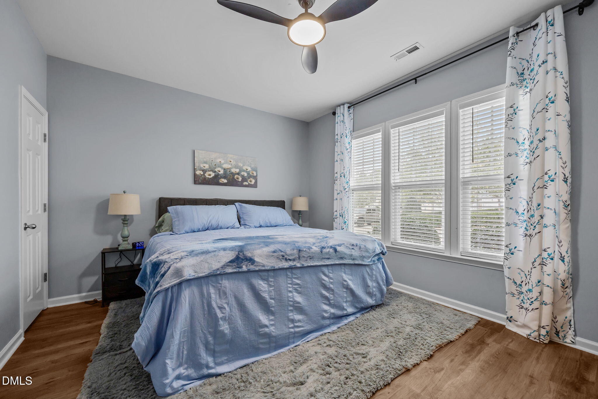 153 Deacon Ridge Street Wake Forest, NC 27587 - Photo 15 of 34 a bedroom with a large bed and a window