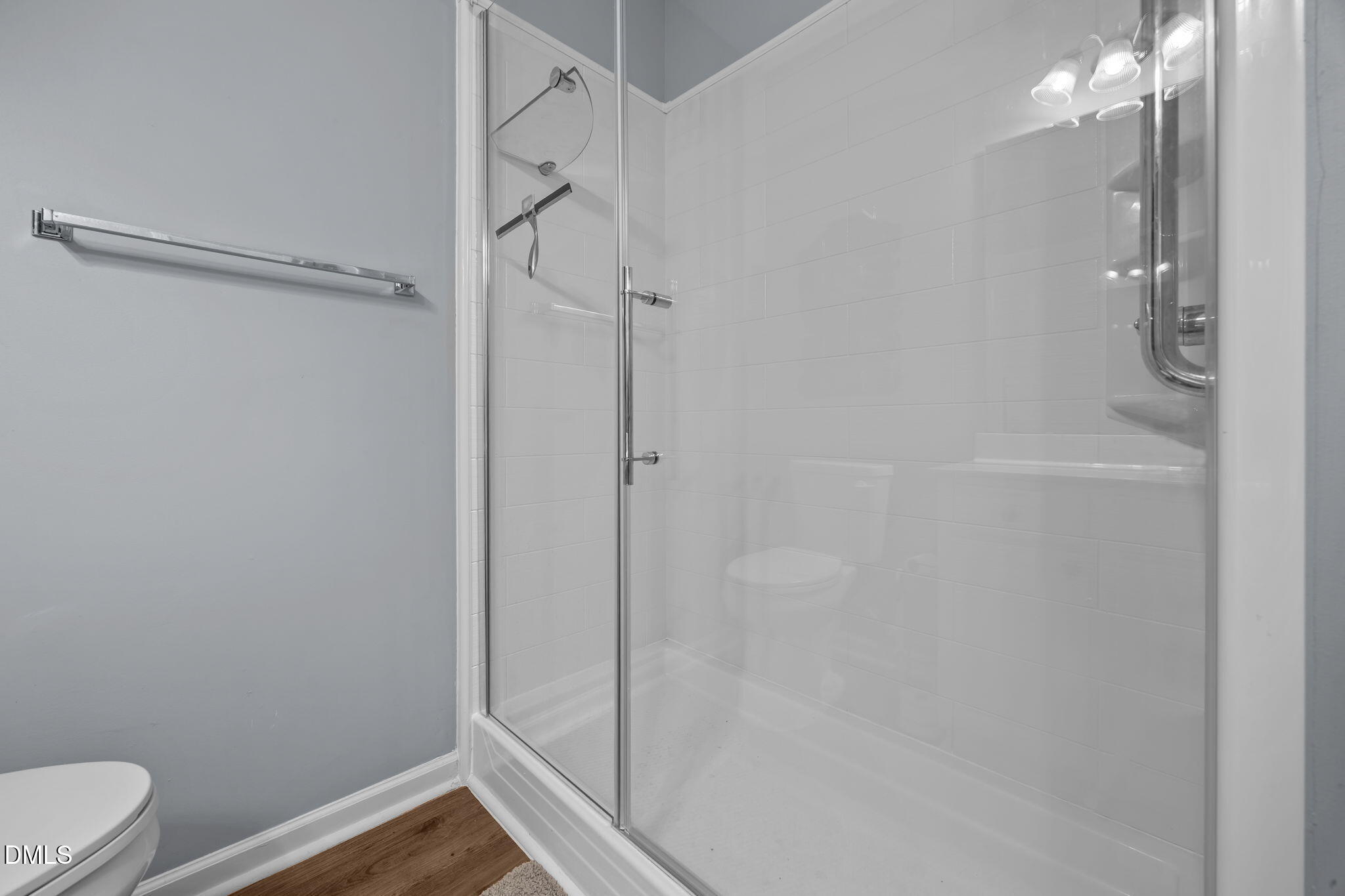 153 Deacon Ridge Street Wake Forest, NC 27587 - Photo 19 of 34 a bathroom with a shower and toilet