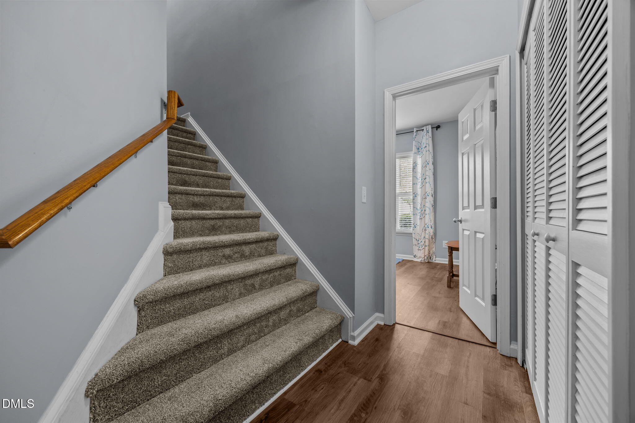 153 Deacon Ridge Street Wake Forest, NC 27587 - Photo 20 of 34 a view of a hallway with wooden floor and entryway