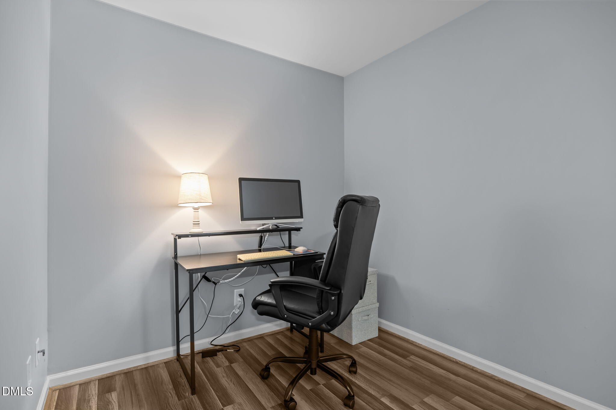 153 Deacon Ridge Street Wake Forest, NC 27587 - Photo 25 of 34 a view of a workspace with furniture and wooden floor