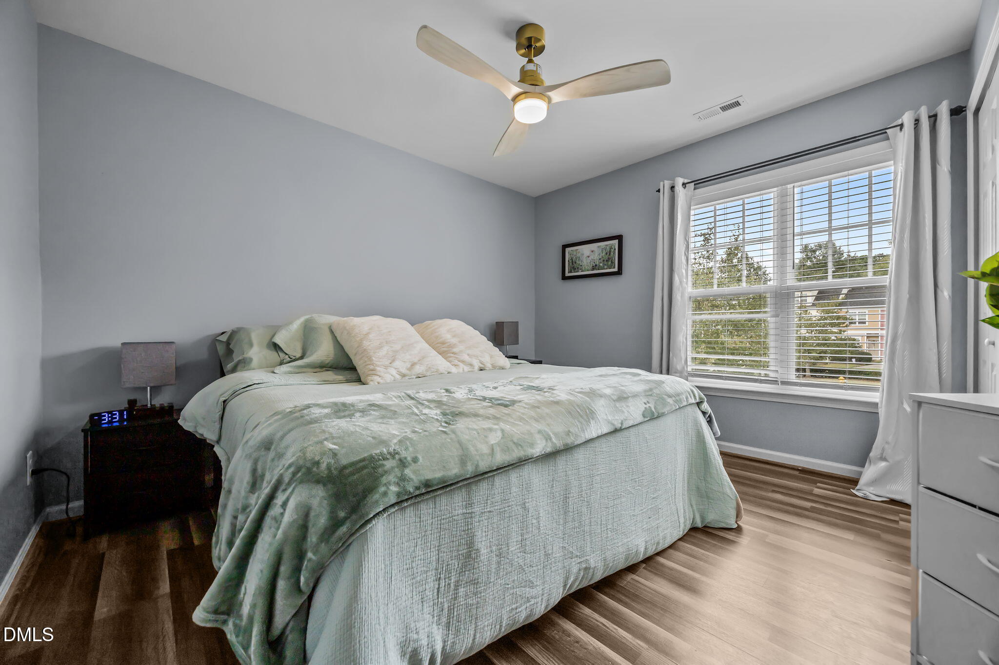 153 Deacon Ridge Street Wake Forest, NC 27587 - Photo 28 of 34 a bedroom with a bed and a window