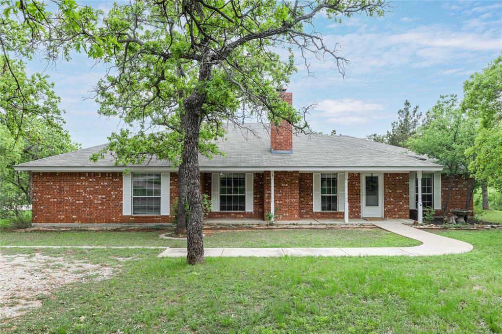 front view of a house with a yard