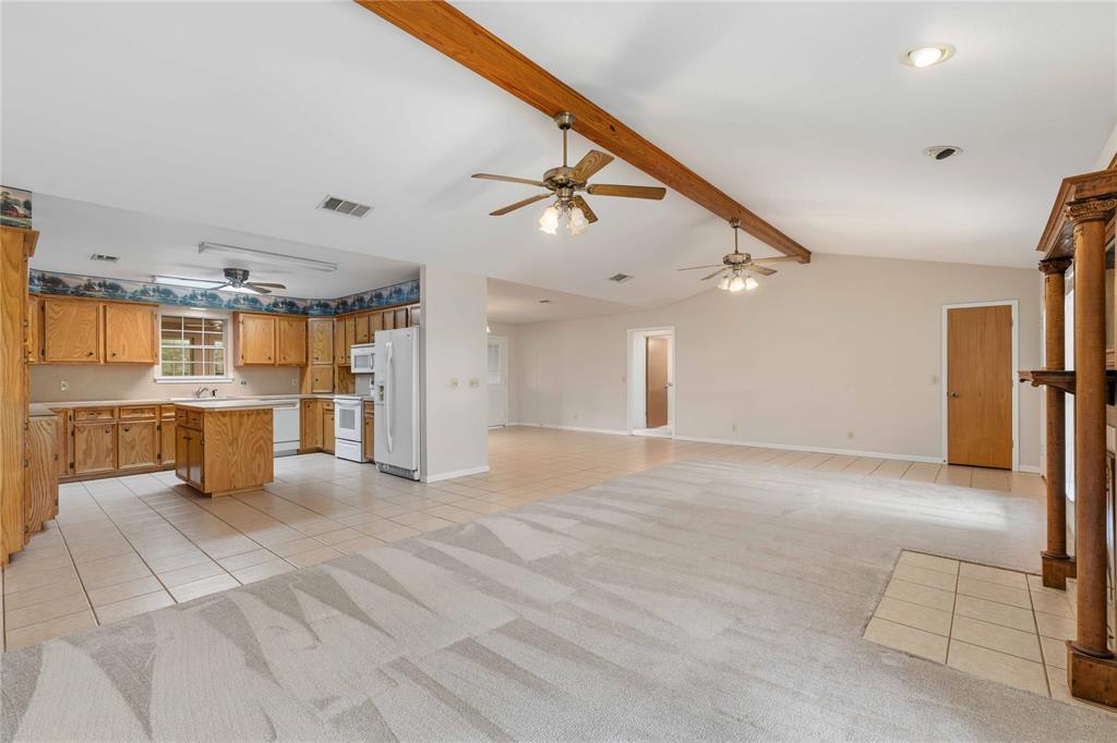 4300 County Road 372 Early, TX 76802 - Photo 11 of 40 a view of a kitchen with a sink and a refrigerator