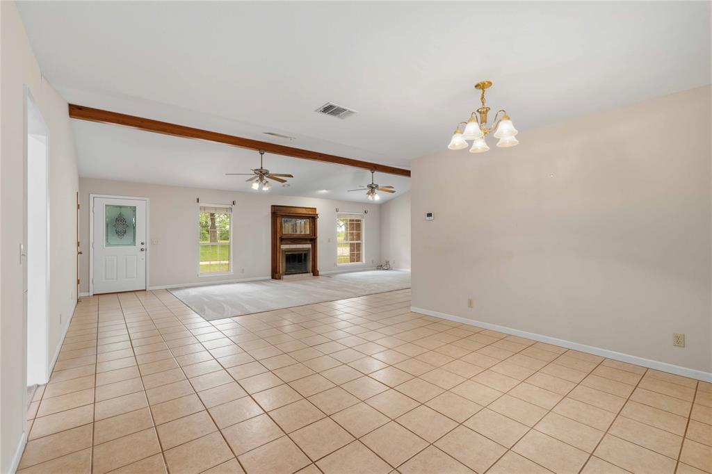 4300 County Road 372 Early, TX 76802 - Photo 17 of 40 wooden floor in an empty room with a window