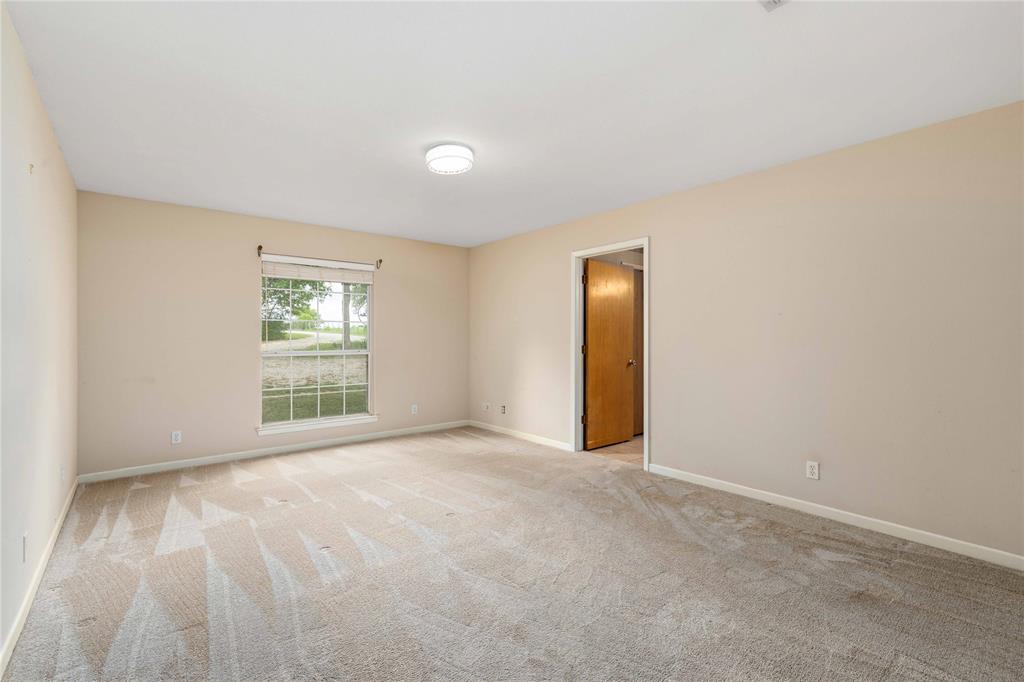 4300 County Road 372 Early, TX 76802 - Photo 18 of 40 a view of an empty room with a window