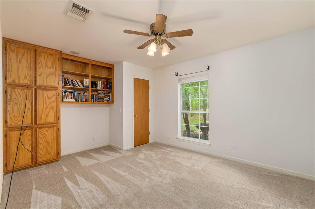 4300 County Road 372 Early, TX 76802 - Photo 21 of 40 a view of an empty room with a window