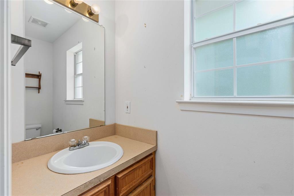 4300 County Road 372 Early, TX 76802 - Photo 25 of 40 a bathroom with a sink and a mirror