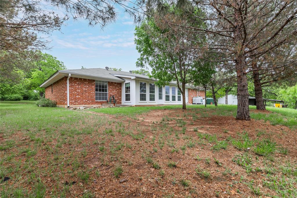 4300 County Road 372 Early, TX 76802 - Photo 30 of 40 a view of a house with yard and tree s