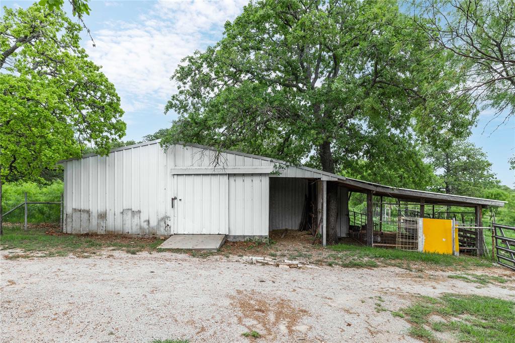 4300 County Road 372 Early, TX 76802 - Photo 34 of 40 a view of a house with backyard and trees