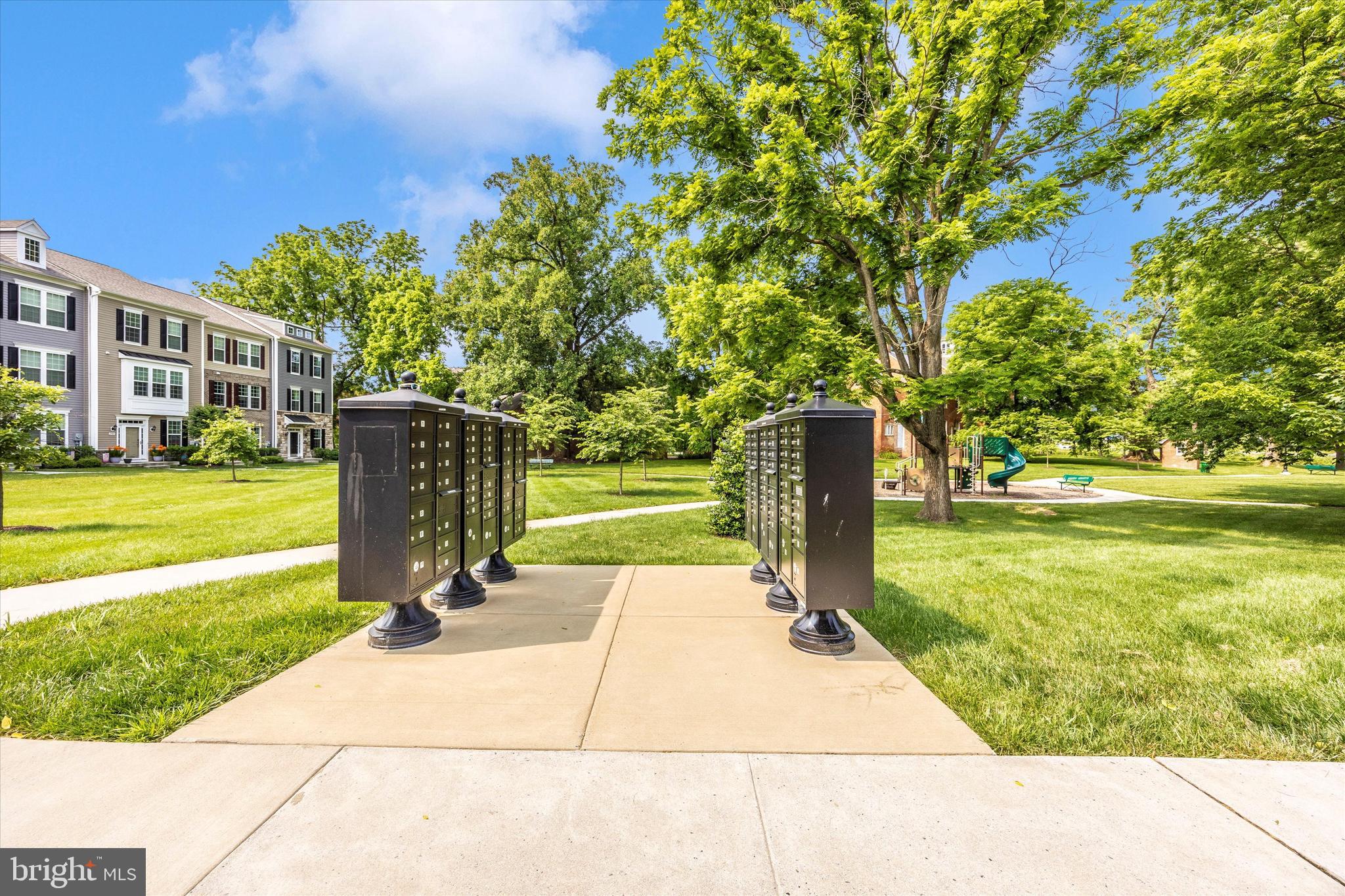 102 Spring Bank Way Frederick, MD 21701 - Photo 12 of 14 a park view with a fountain plants and large trees