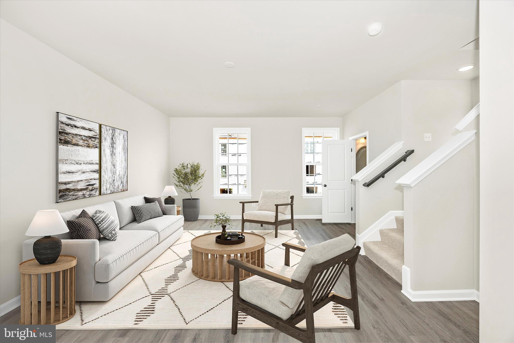 102 Spring Bank Way Frederick, MD 21701 - Photo 4 of 14 a living room with furniture and a large window