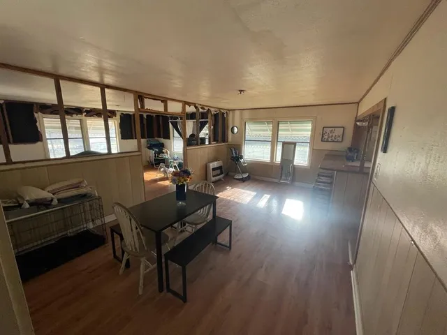 a view of a livingroom with furniture and a window