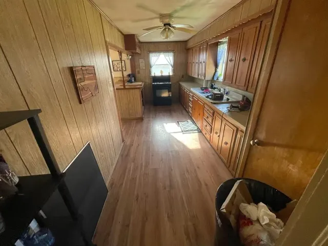 a bedroom with furniture and a window