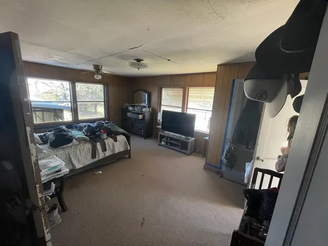 a view of a closet with wooden floor