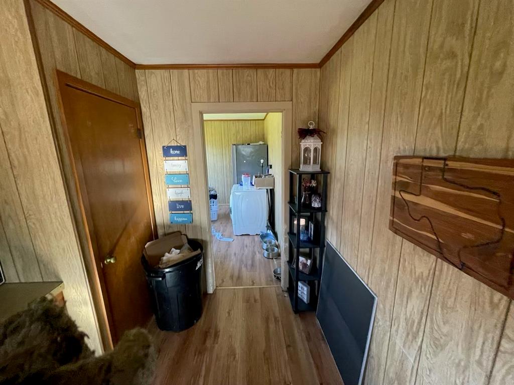 1227 Highway 82 Nocona, TX 76255 - Photo 19 of 19 a view of a closet with wooden floor