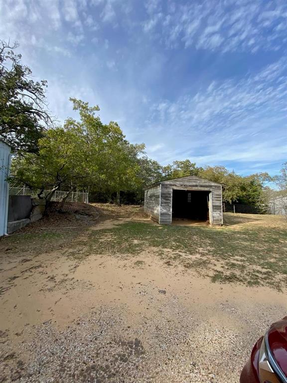 1227 Highway 82 Nocona, TX 76255 - Photo 7 of 19 a view of a yard with an outdoor space