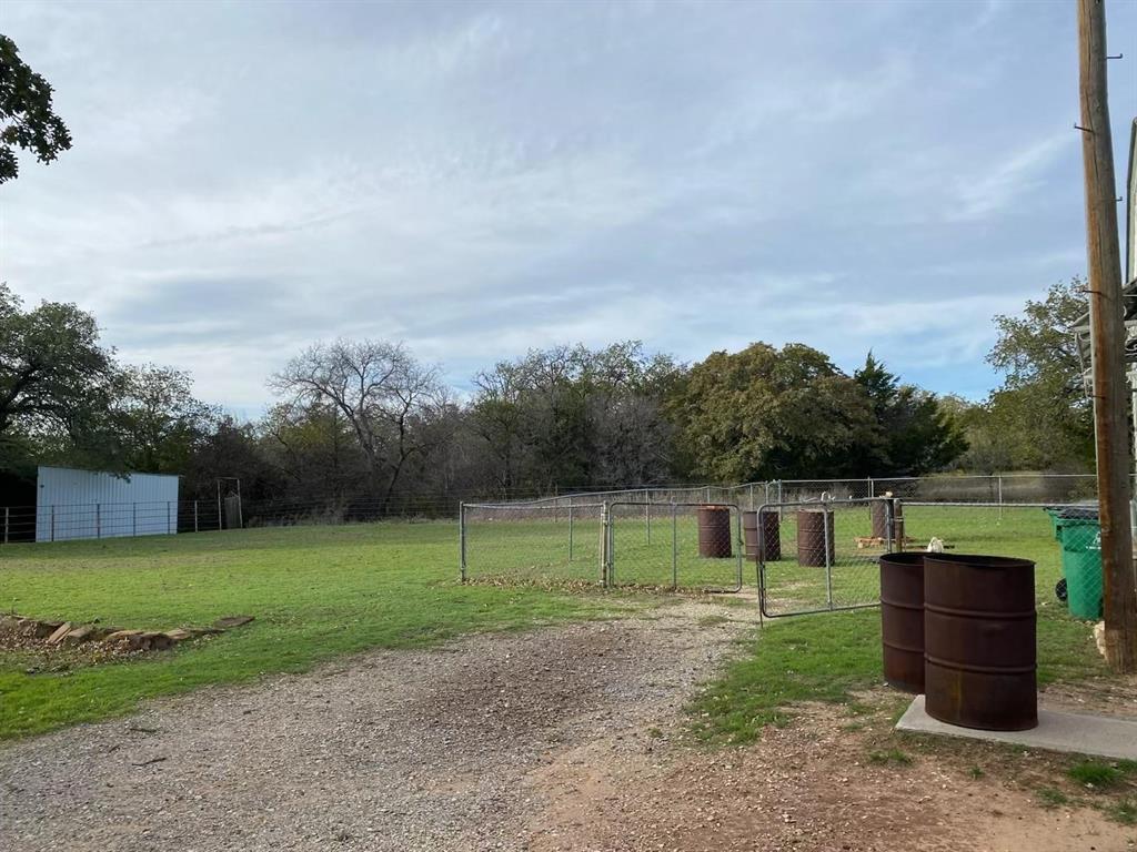 1227 Highway 82 Nocona, TX 76255 - Photo 8 of 19 a view of a garden with large trees