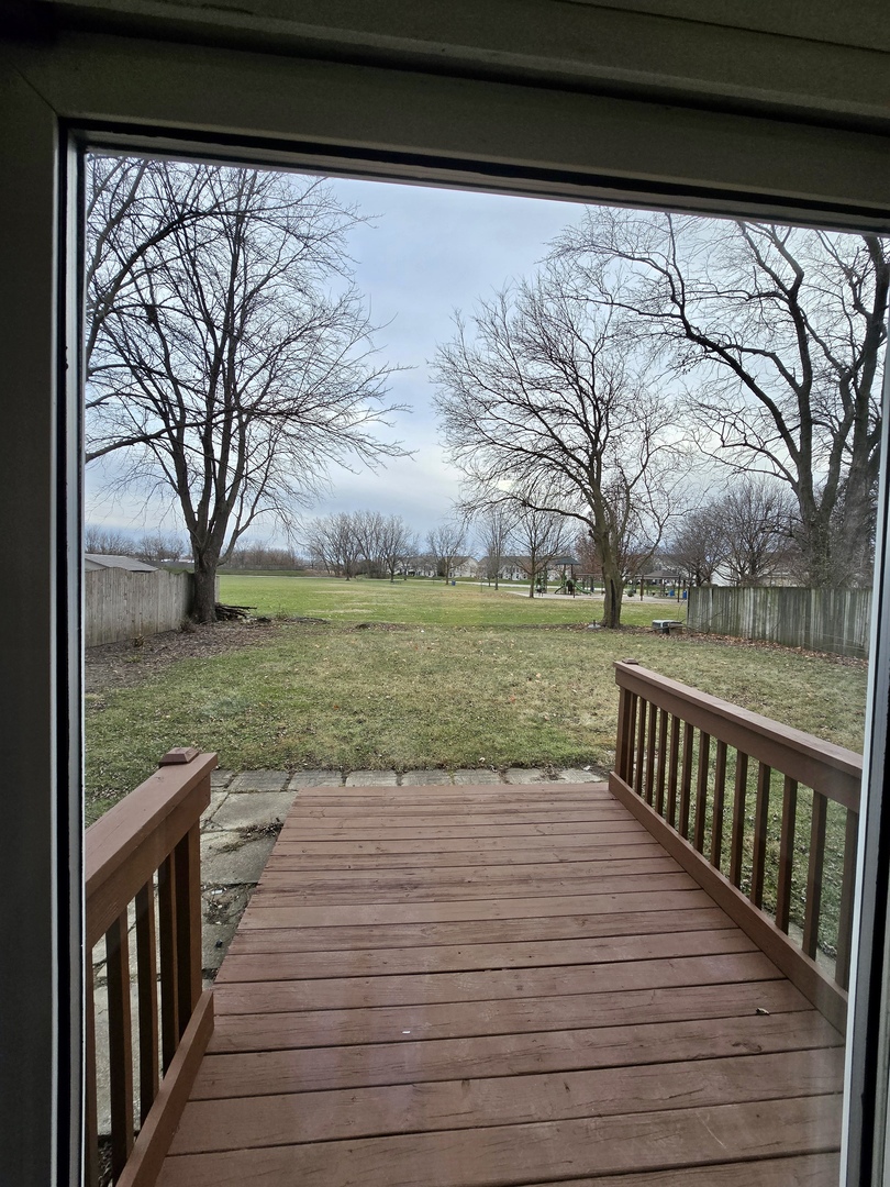 1010 Ridgewood Drive Bolingbrook, IL 60440 - Photo 23 of 29 a view of wooden deck with a yard