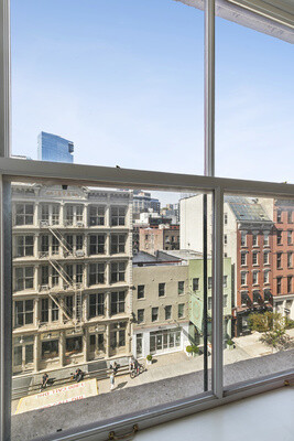 391 West Broadway, Unit 4WB Manhattan, NY 10012 - Photo 3 of 6 a view of a building from a window