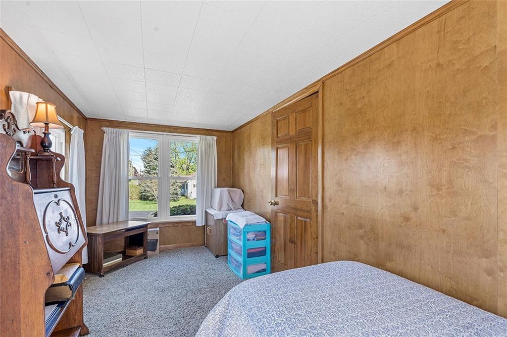 120 Township Line Road Butler, PA 16002 - Photo 17 of 25 a bed room with a bed and a chair