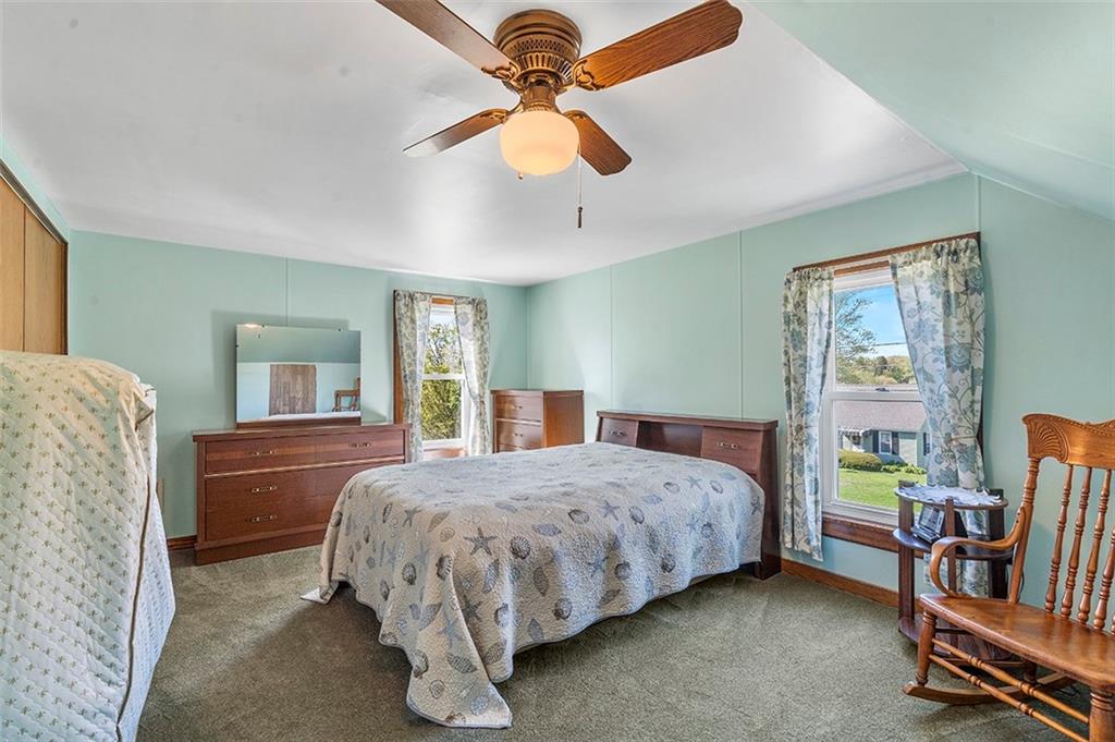120 Township Line Road Butler, PA 16002 - Photo 23 of 25 a bedroom with a bed and a chandelier