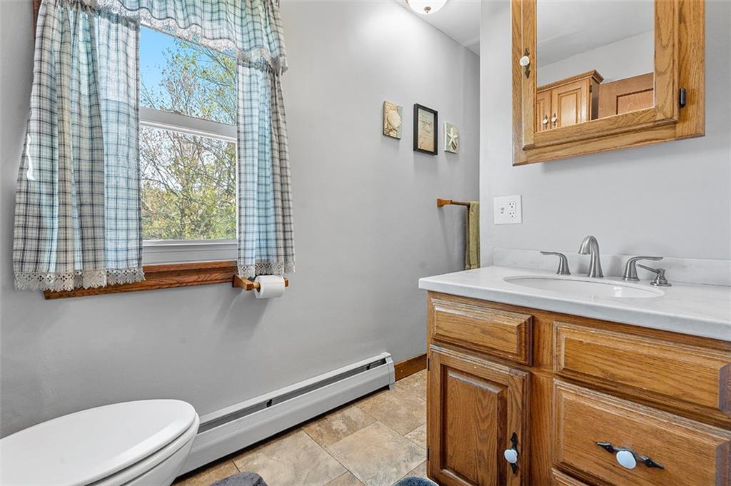 120 Township Line Road Butler, PA 16002 - Photo 24 of 25 a bathroom with a sink a toilet and a window