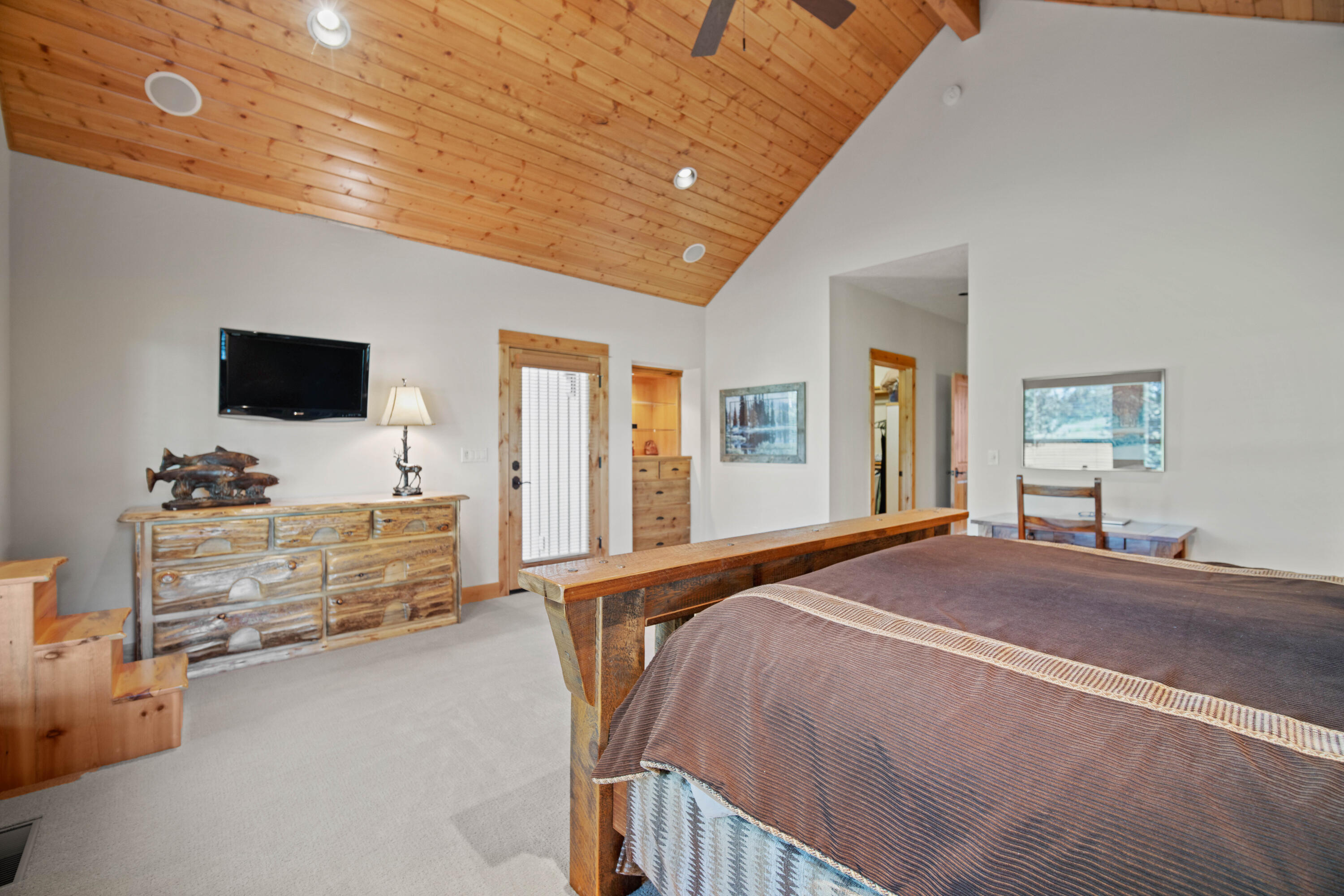 56689 Dancing Rock Loop Bend, OR 97707 - Photo 22 of 51 a bedroom with furniture and flat screen tv