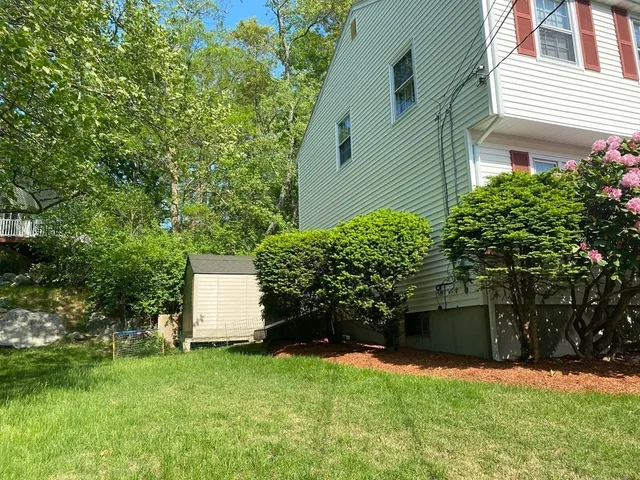 a view of a patio with table and chairs and potted plants