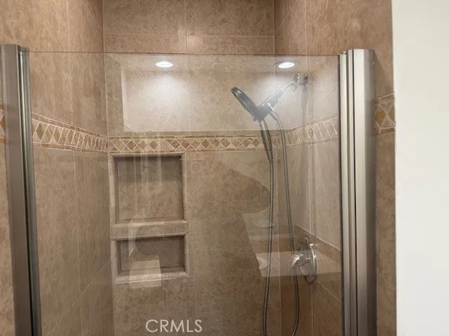 a bathroom with a shower and a toilet