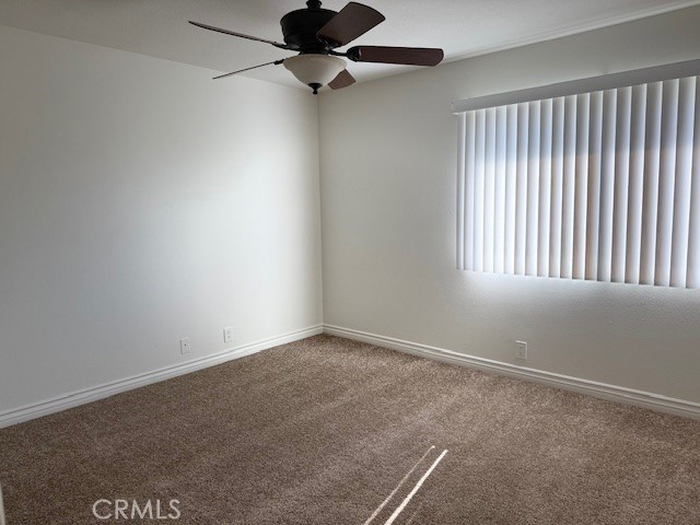79740 Ave 42, Unit 5 Bermuda Dunes, CA 92203 - Photo 19 of 21 an empty room with a window and a fan