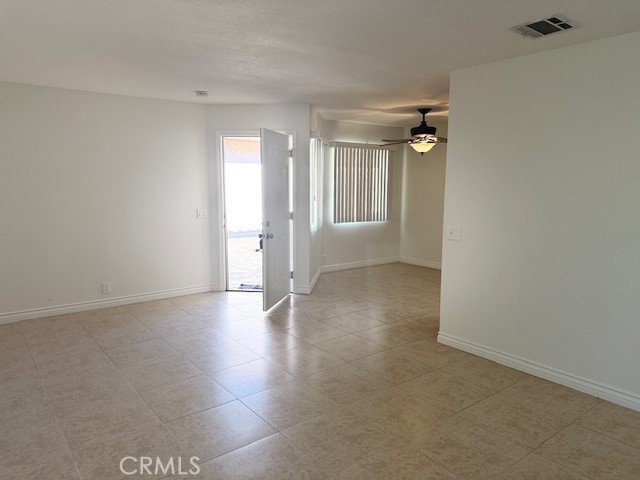 79740 Ave 42, Unit 5 Bermuda Dunes, CA 92203 - Photo 3 of 21 wooden floor in an empty room with a window