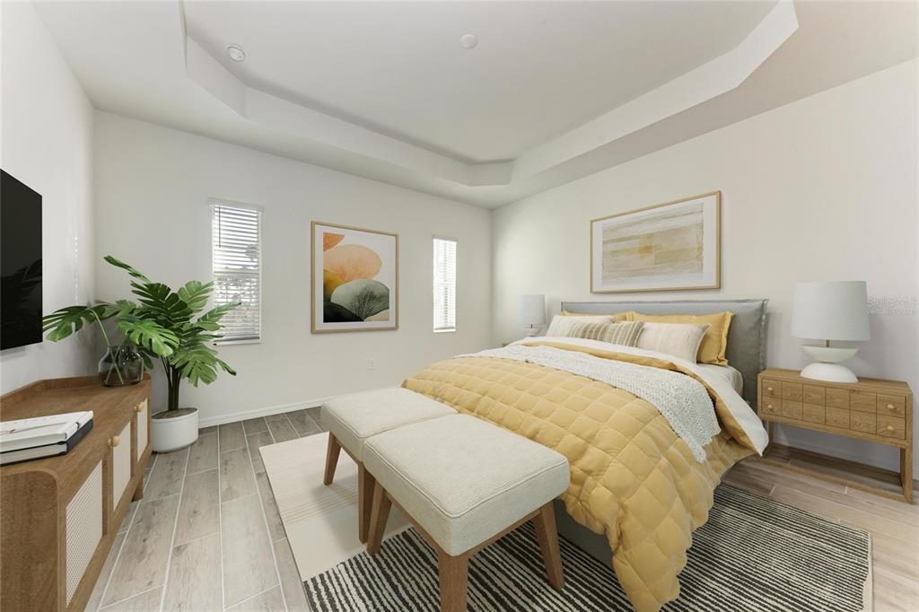 13021 Tulum Loop Venice, FL 34293 - Photo 14 of 66 a bedroom with a bed and a potted plant