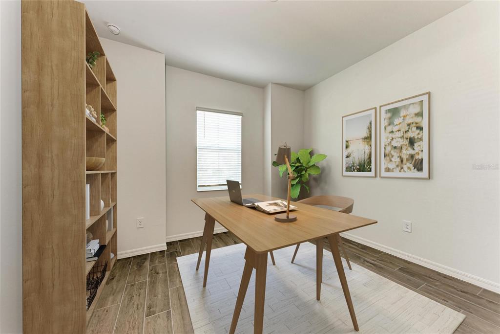 13021 Tulum Loop Venice, FL 34293 - Photo 19 of 66 a view of a workspace with furniture and a potted plant