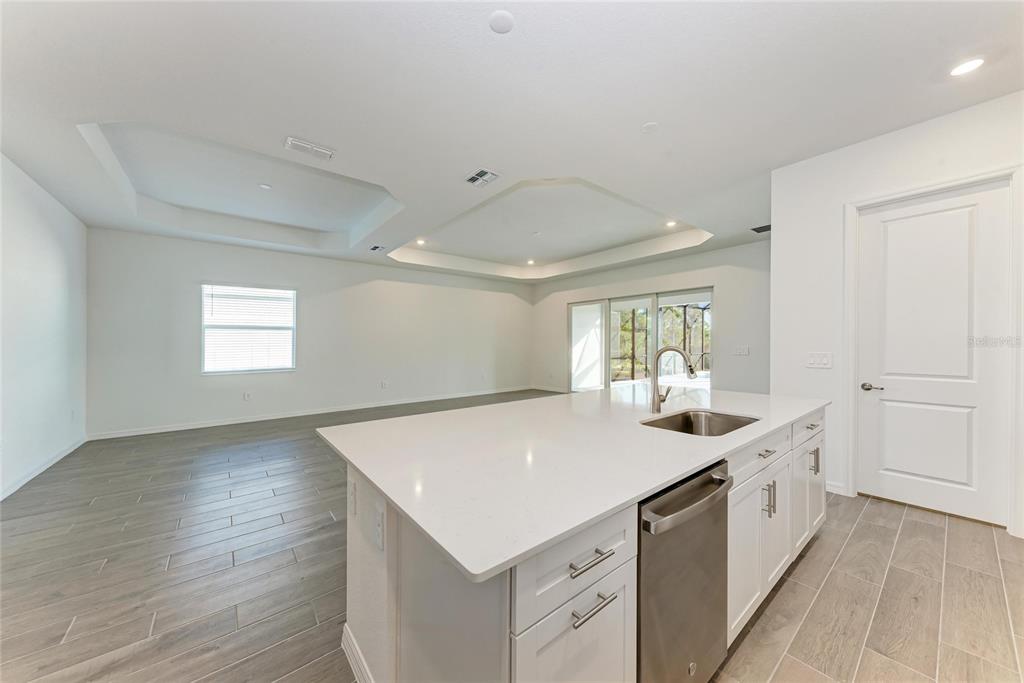 13021 Tulum Loop Venice, FL 34293 - Photo 9 of 66 a view of a kitchen counter top space and windows